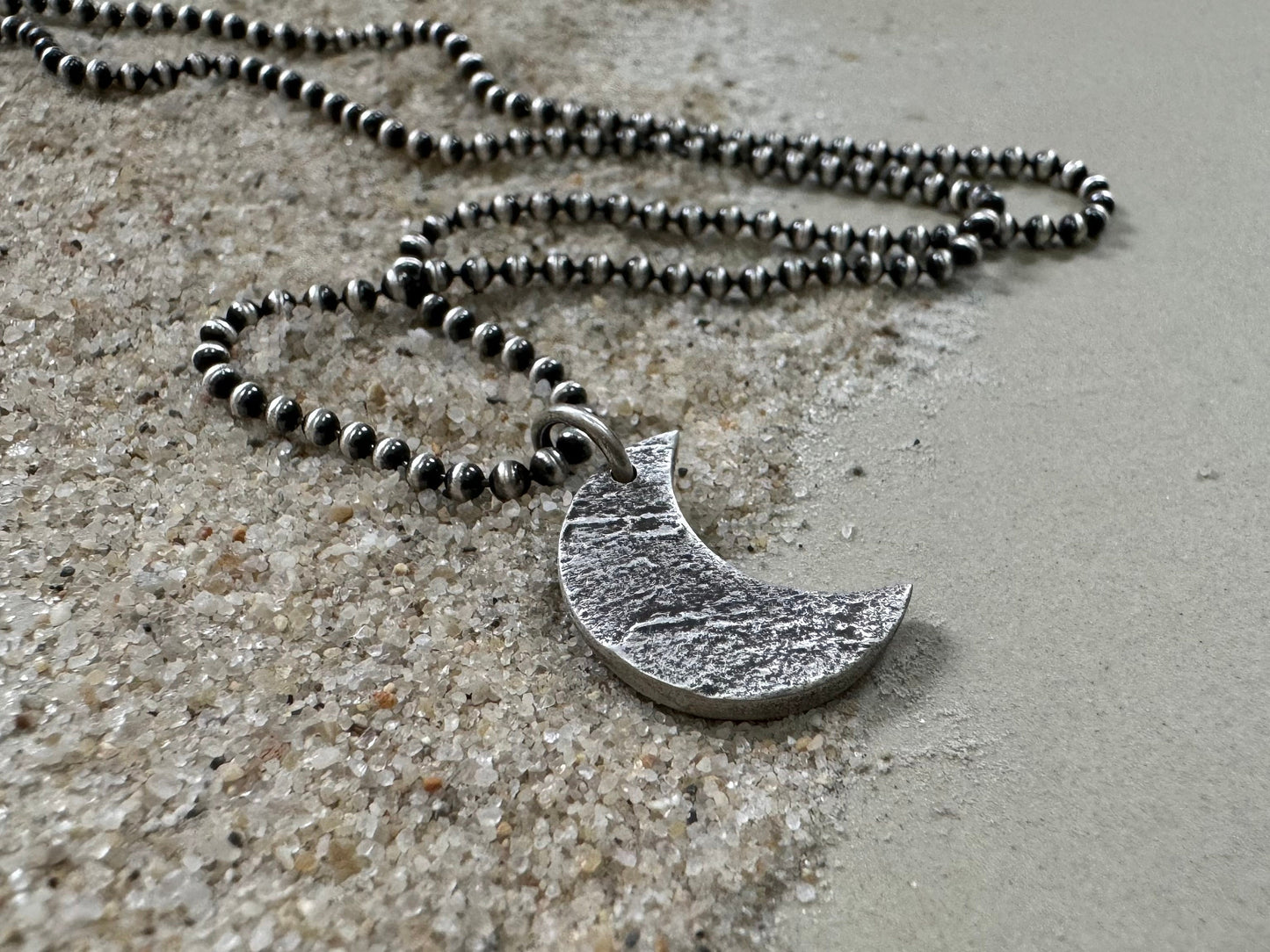 Chunky rock textured silver crescent moon necklace