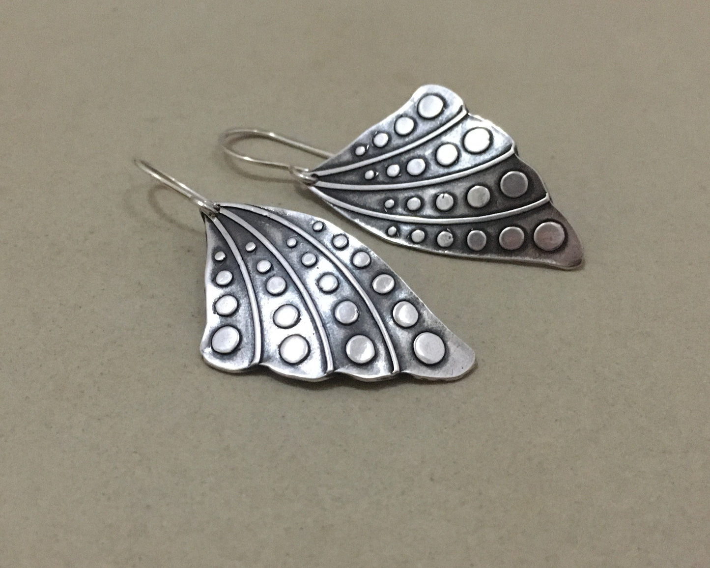 Silver butterfly wing earrings with polka dots