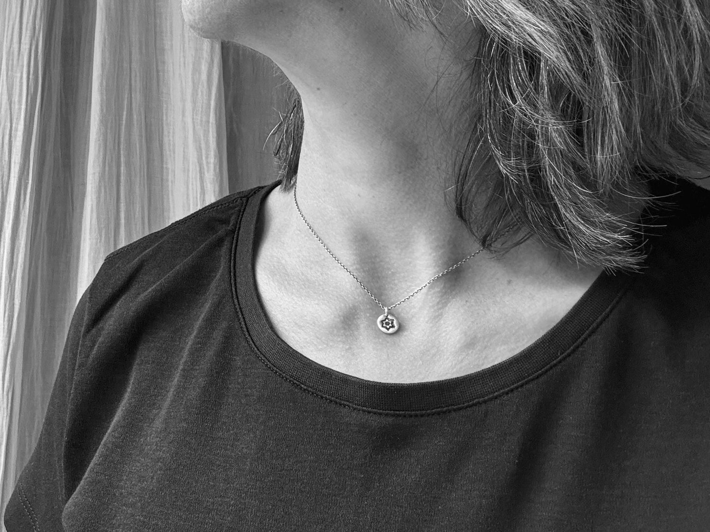 Tiny stamped flower necklace in oxidized sterling silver