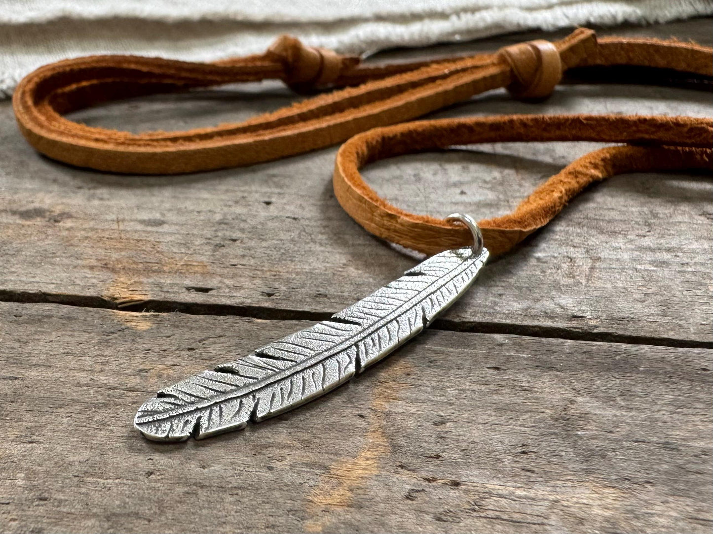 Tribal style silver feather necklace on leather or chain