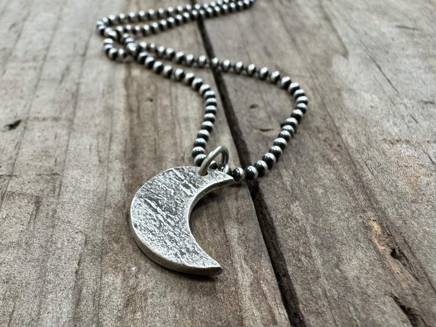 Chunky rock textured silver crescent moon necklace