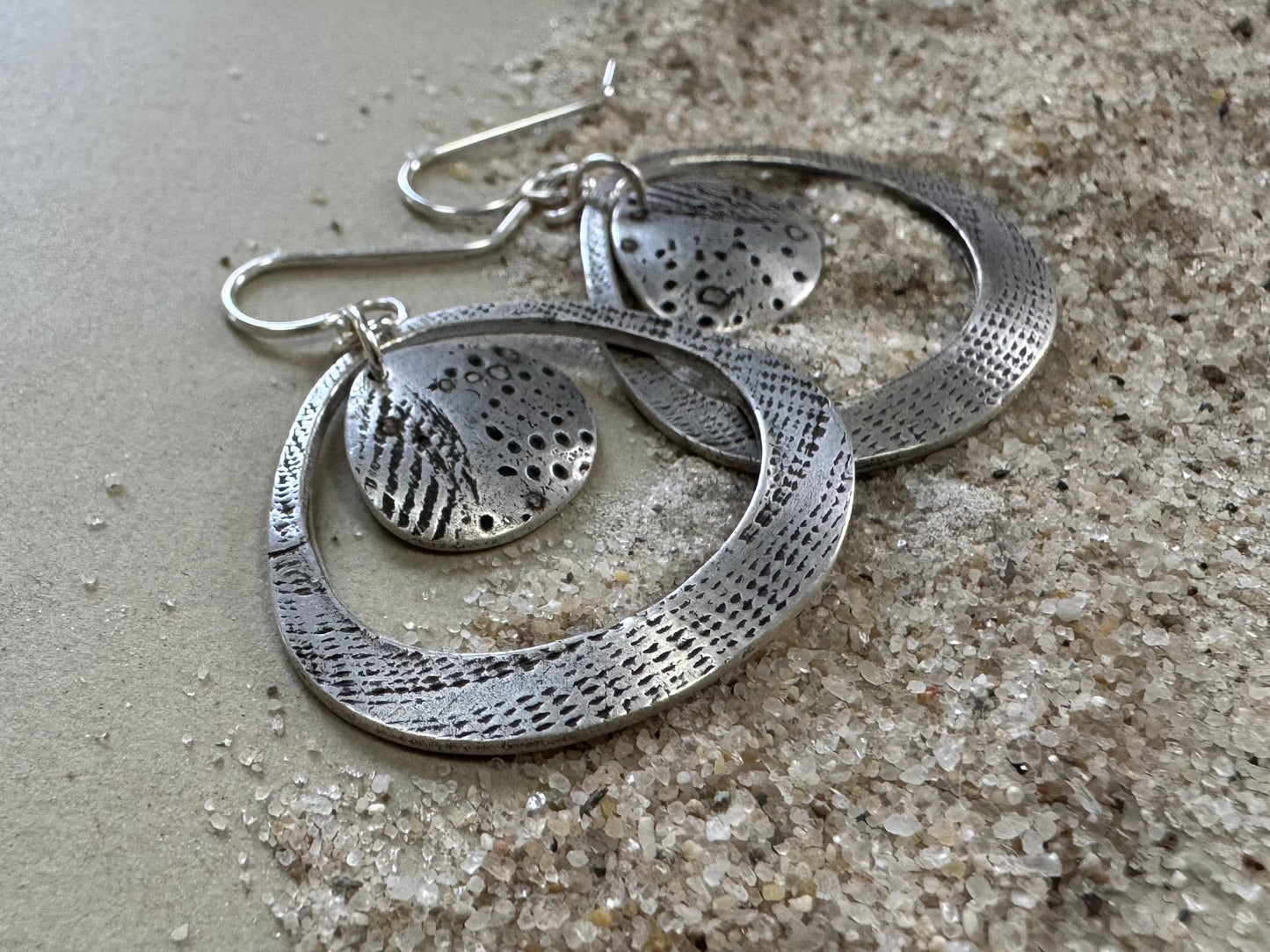 Silver seashell statement earrings with beach sand inclusions