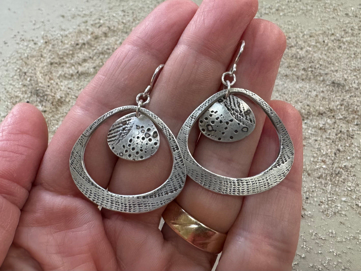 Silver seashell statement earrings with beach sand inclusions
