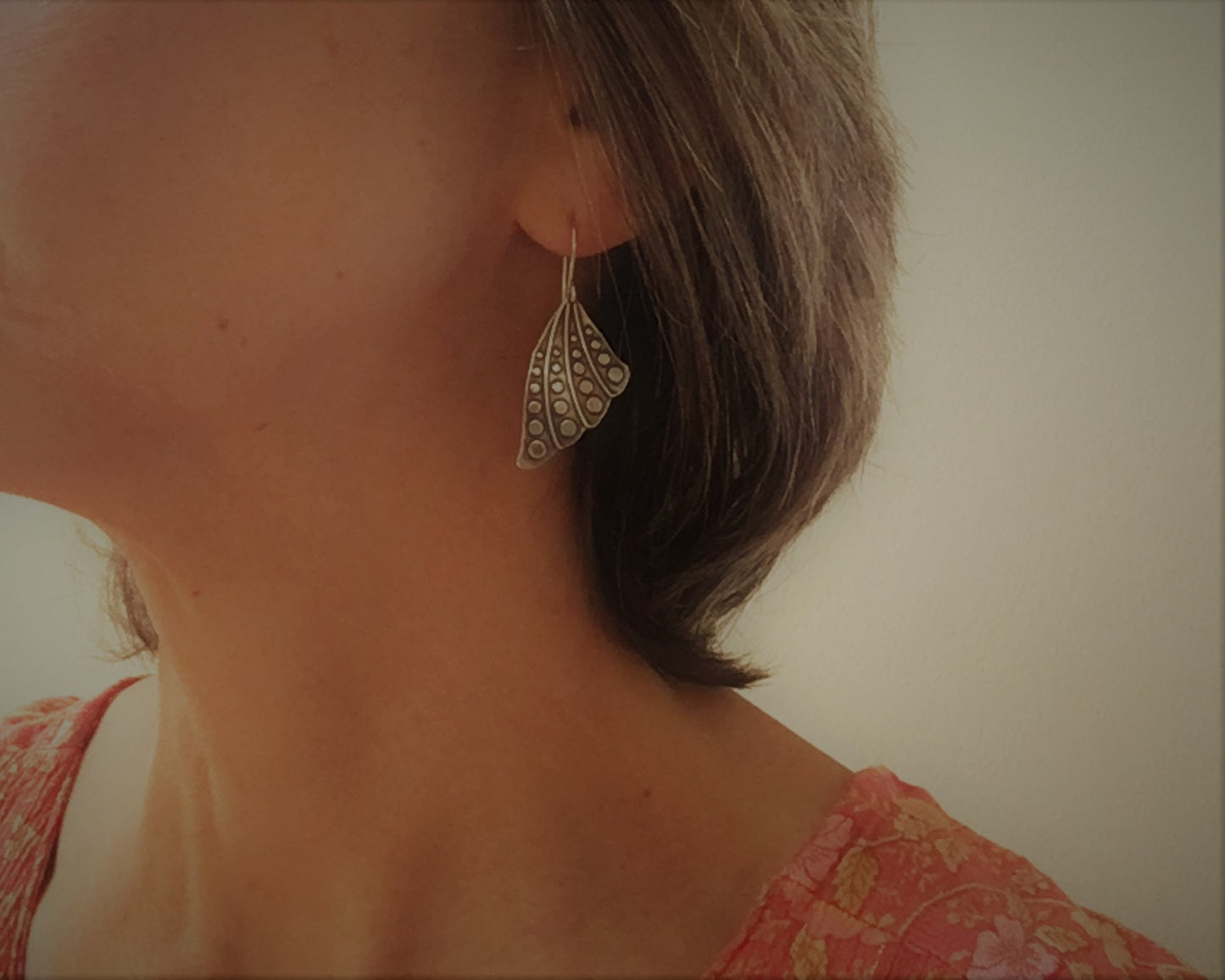 Silver butterfly wing earrings with polka dots