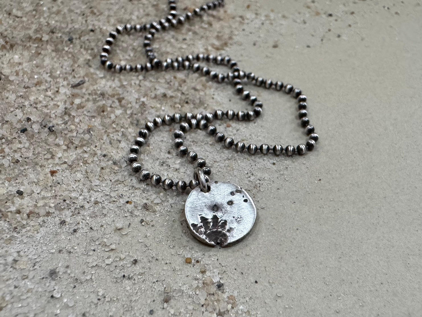 Small silver shell and sand necklace