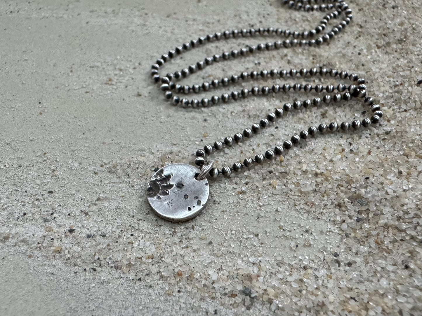 Small silver shell and sand necklace