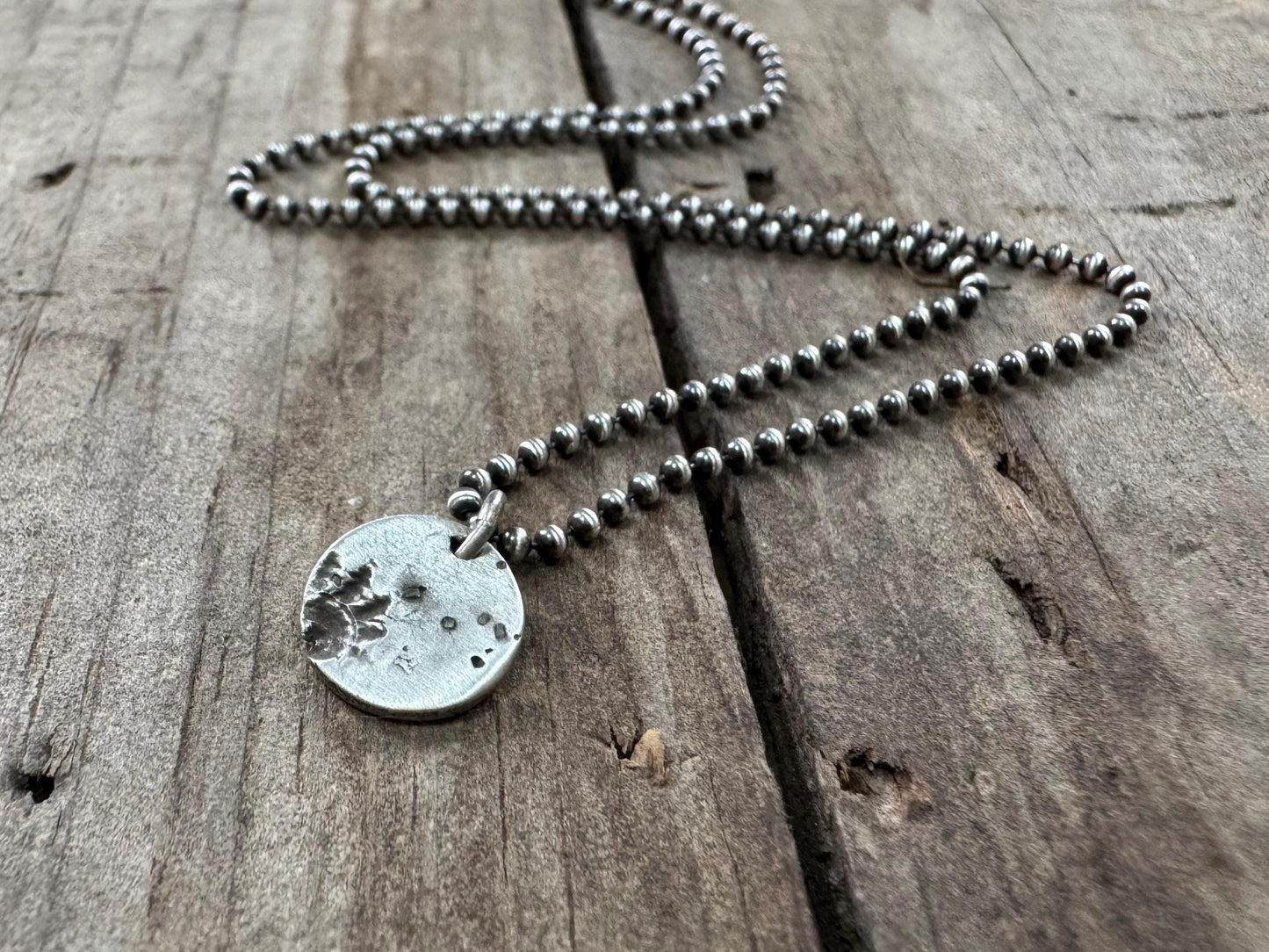 Small silver shell and sand necklace