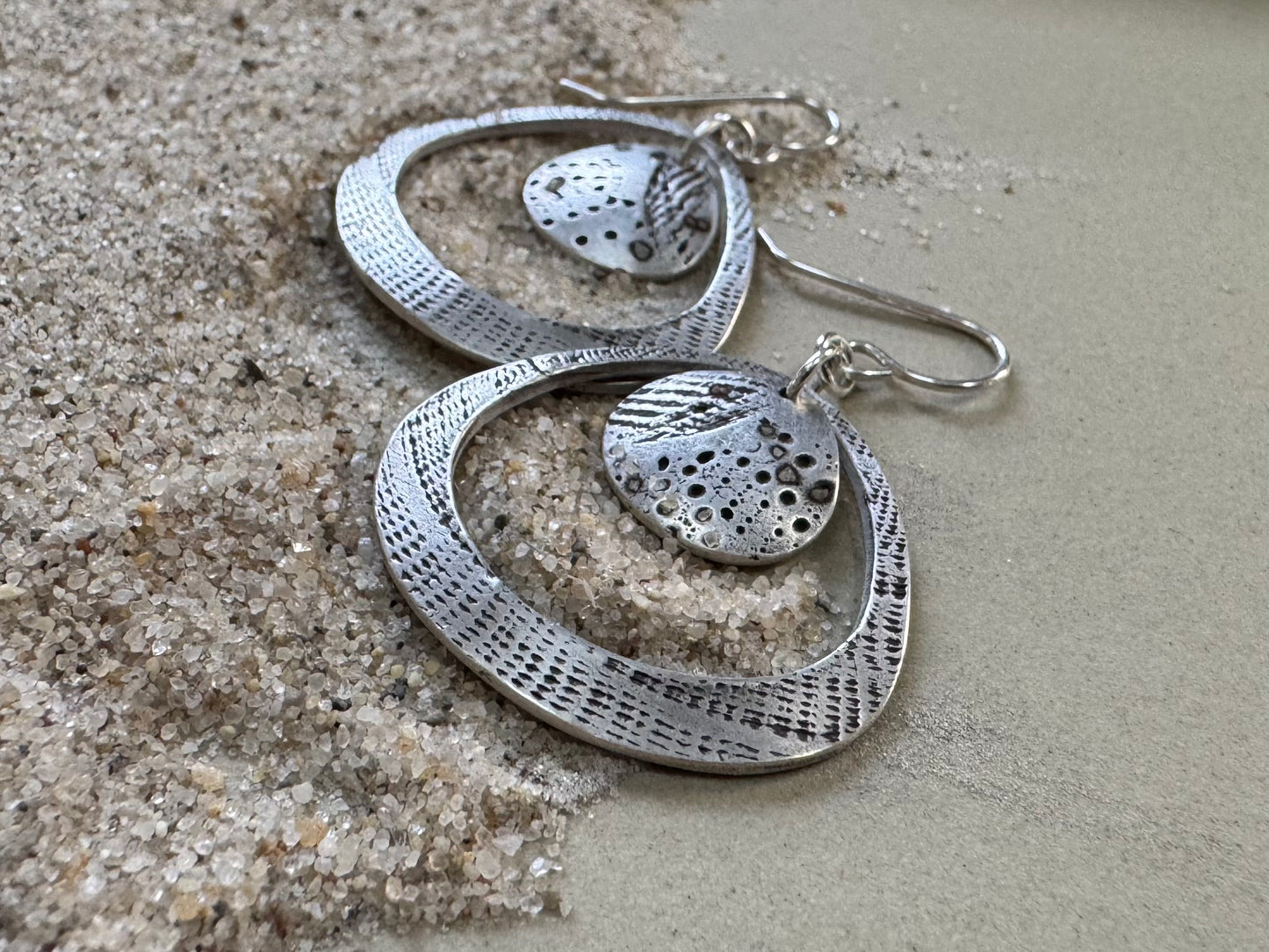 Silver seashell statement earrings with beach sand inclusions