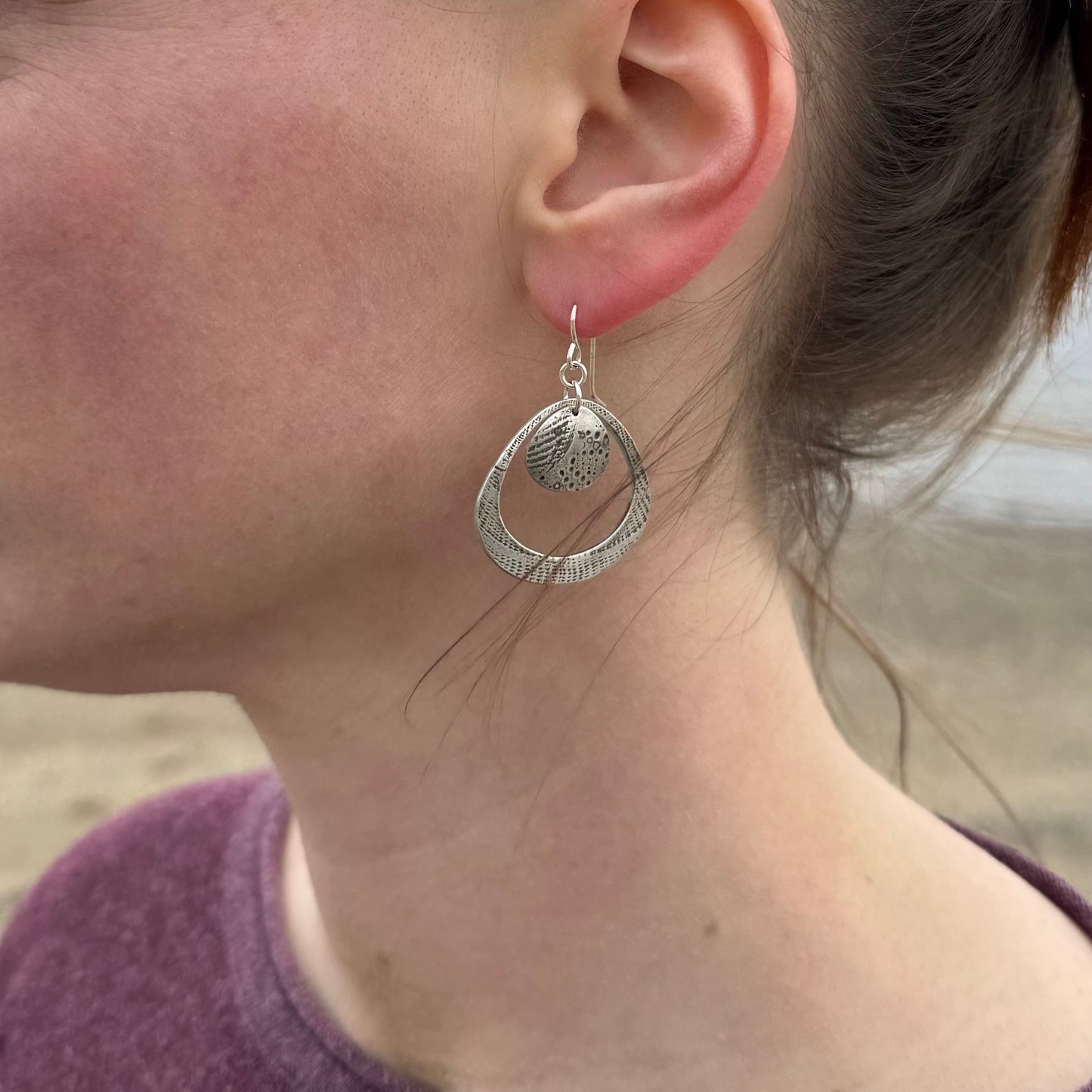 Silver seashell statement earrings with beach sand inclusions