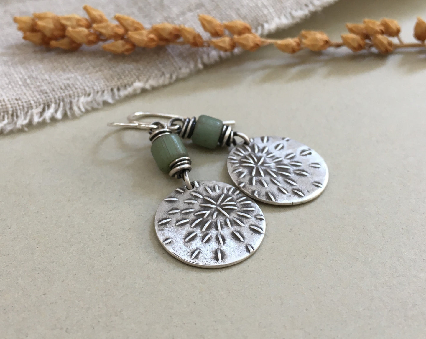 Silver starburst sashiko stitch earrings with seafoam green Java glass