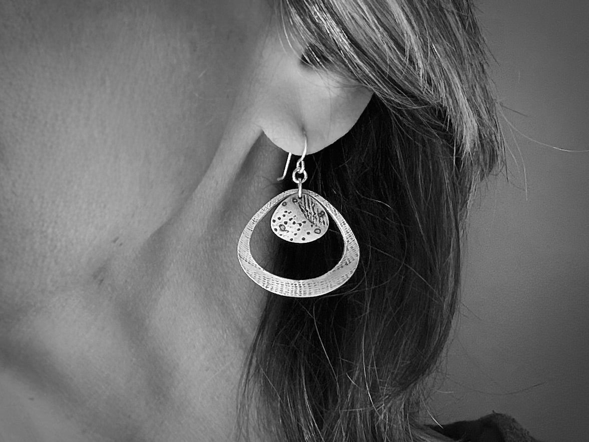 Silver seashell statement earrings with beach sand inclusions