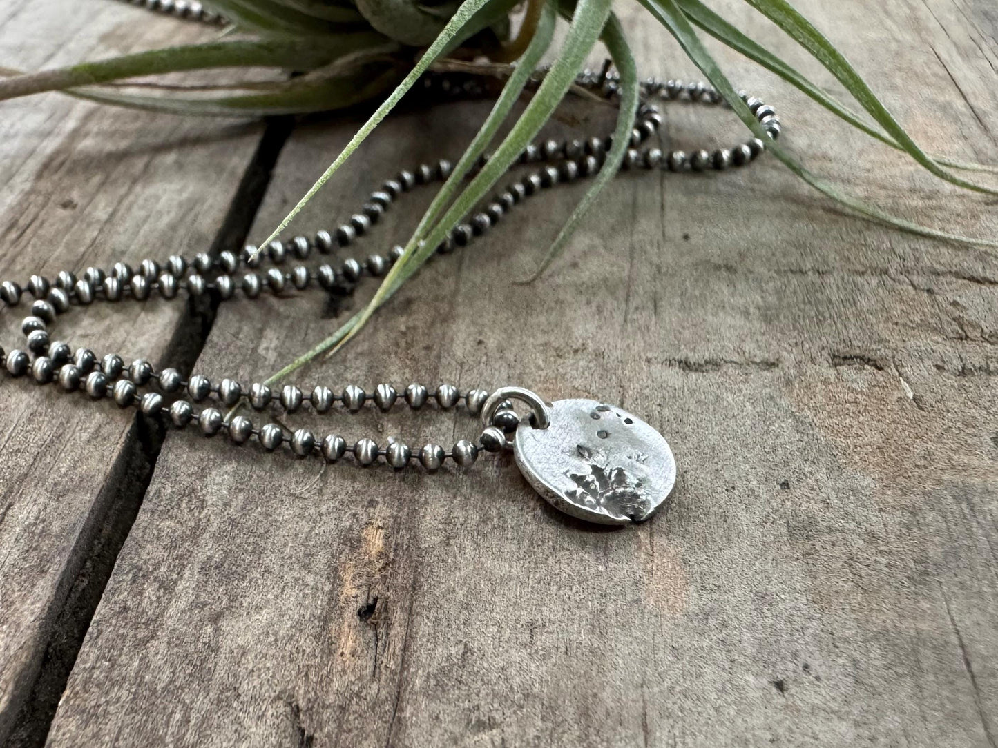 Small silver shell and sand necklace