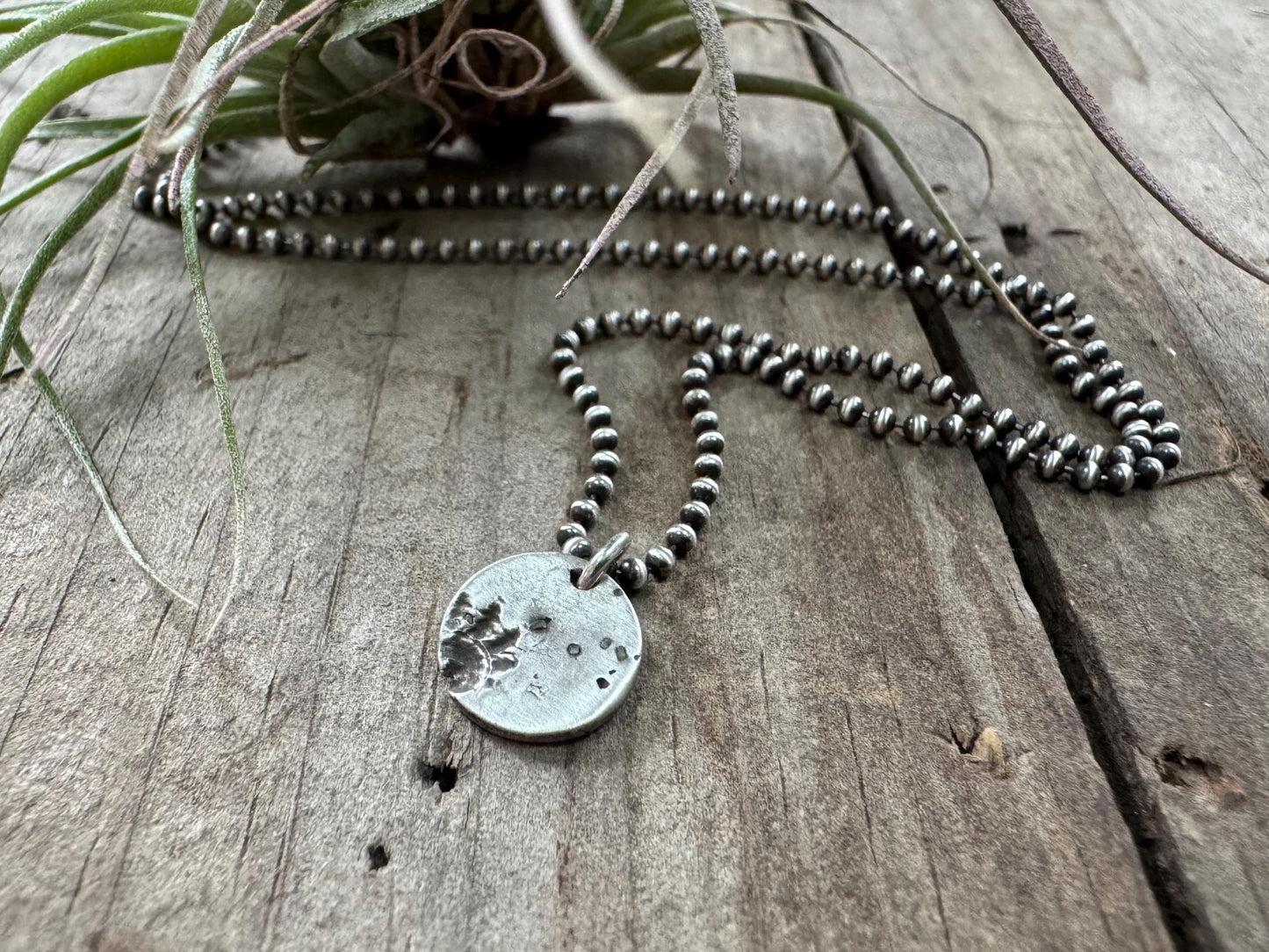 Small silver shell and sand necklace