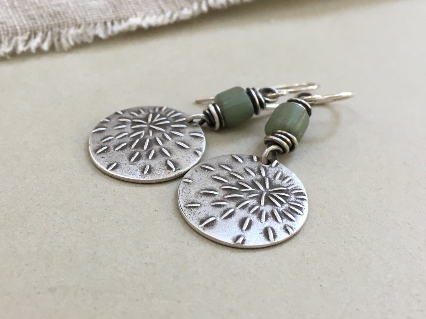 Silver starburst sashiko stitch earrings with seafoam green Java glass