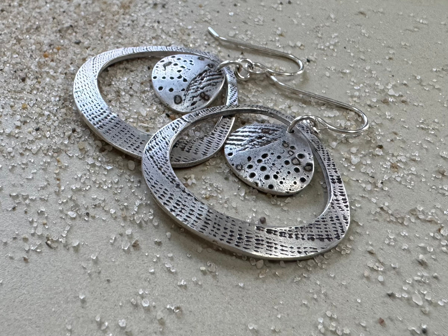 Silver seashell statement earrings with beach sand inclusions