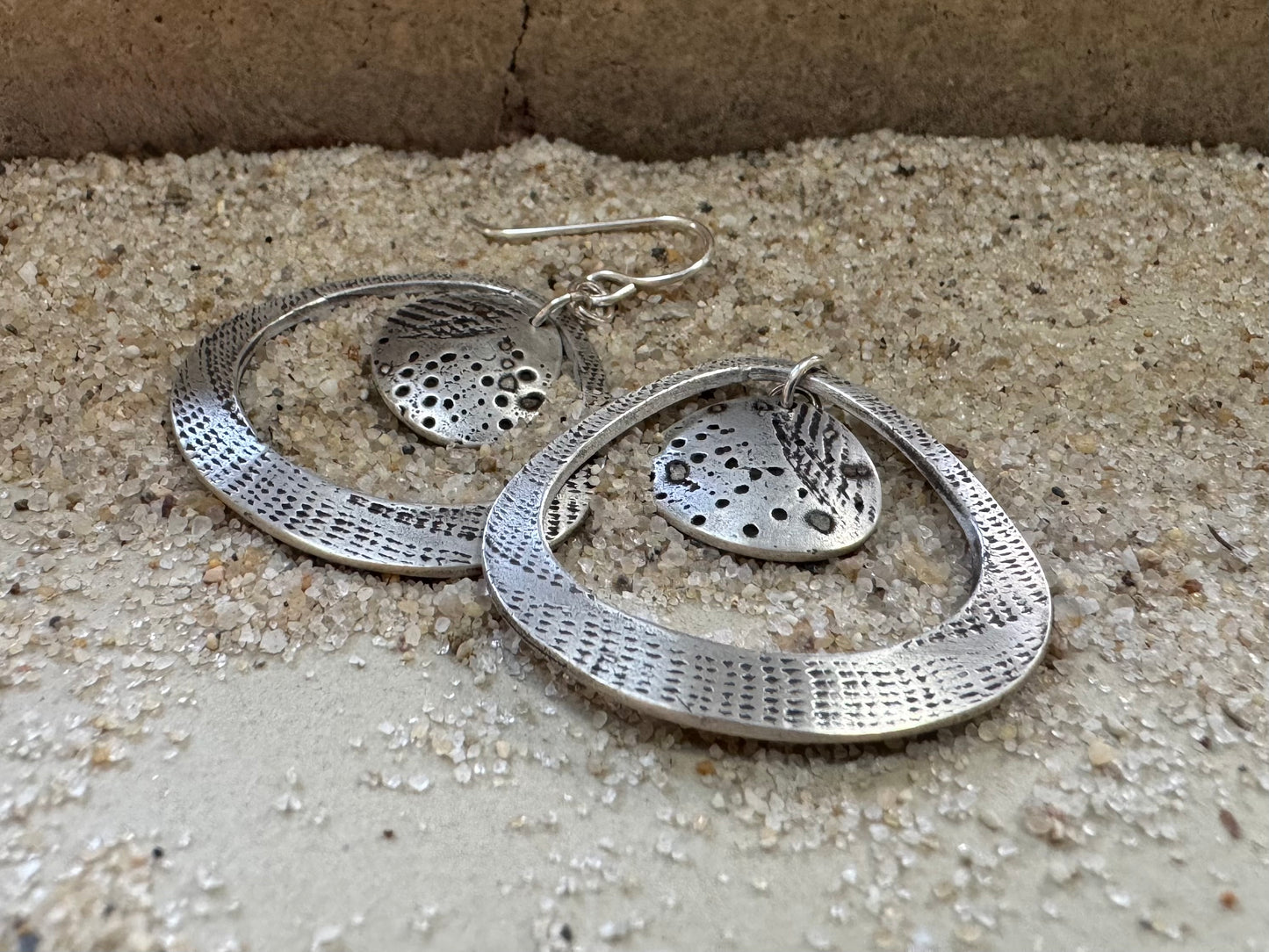 Silver seashell statement earrings with beach sand inclusions