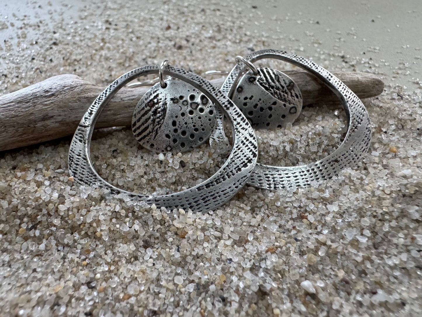 Silver seashell statement earrings with beach sand inclusions