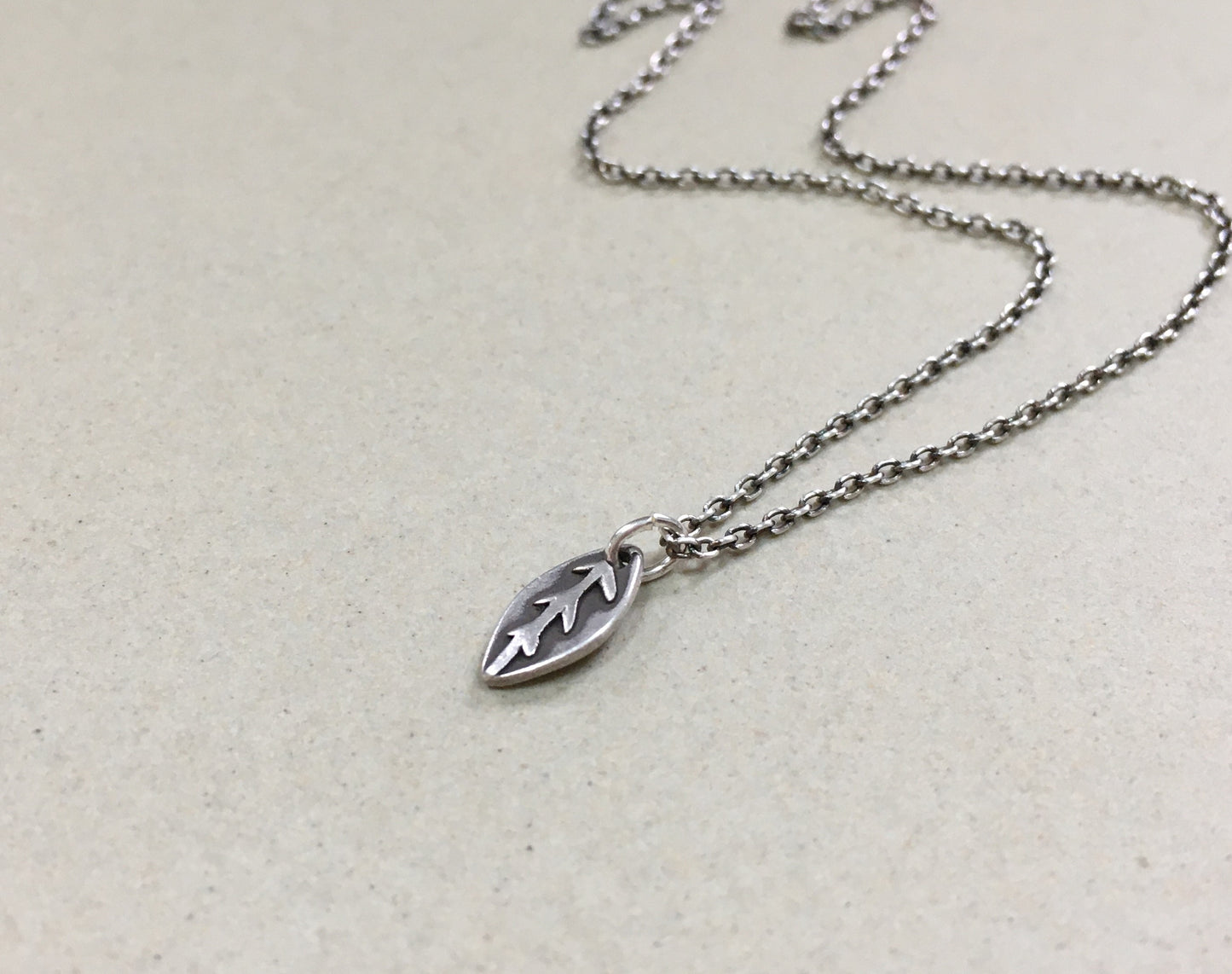 Tiny silver leaf necklace in oxidized sterling silver