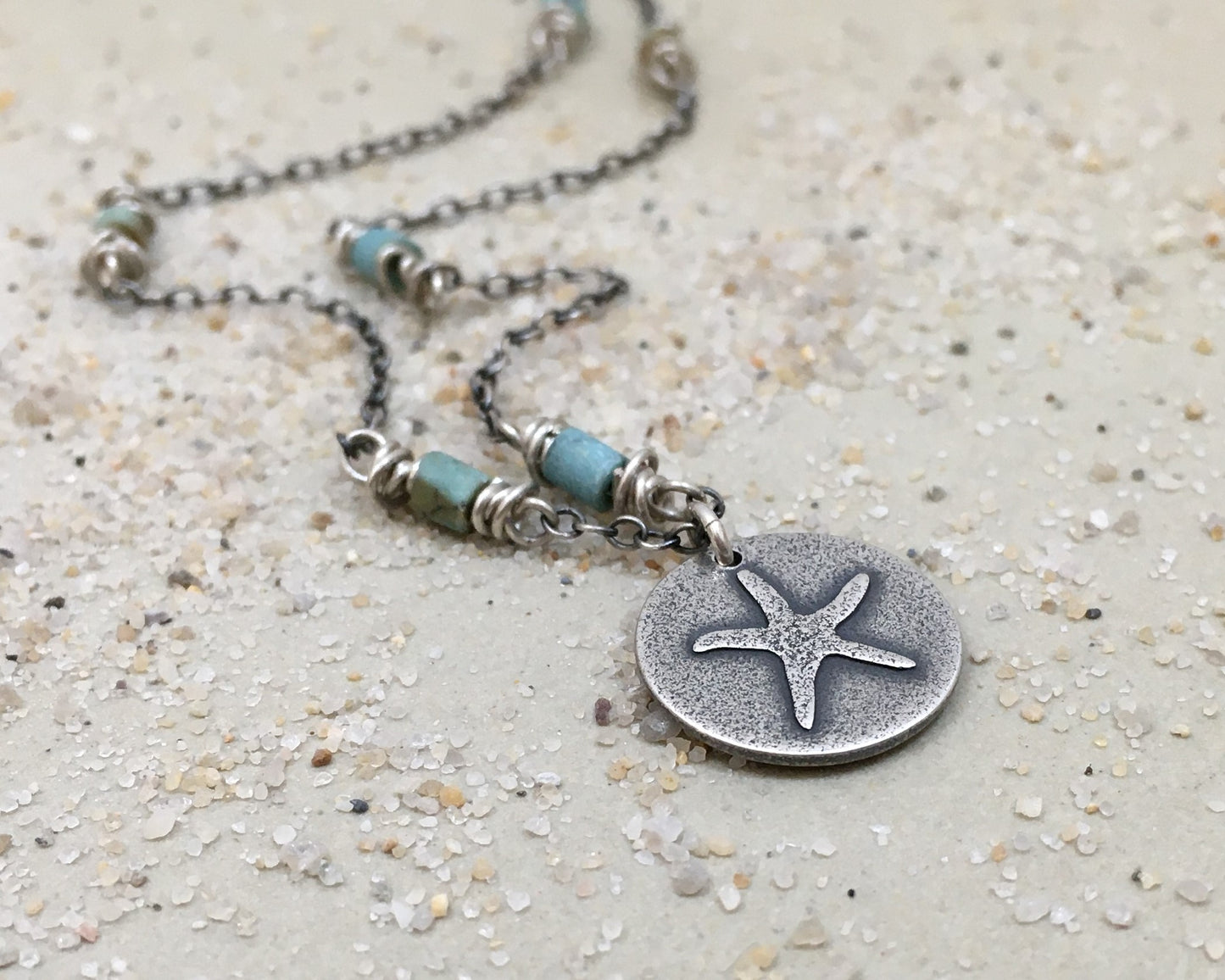 Silver starfish necklace on beaded chain