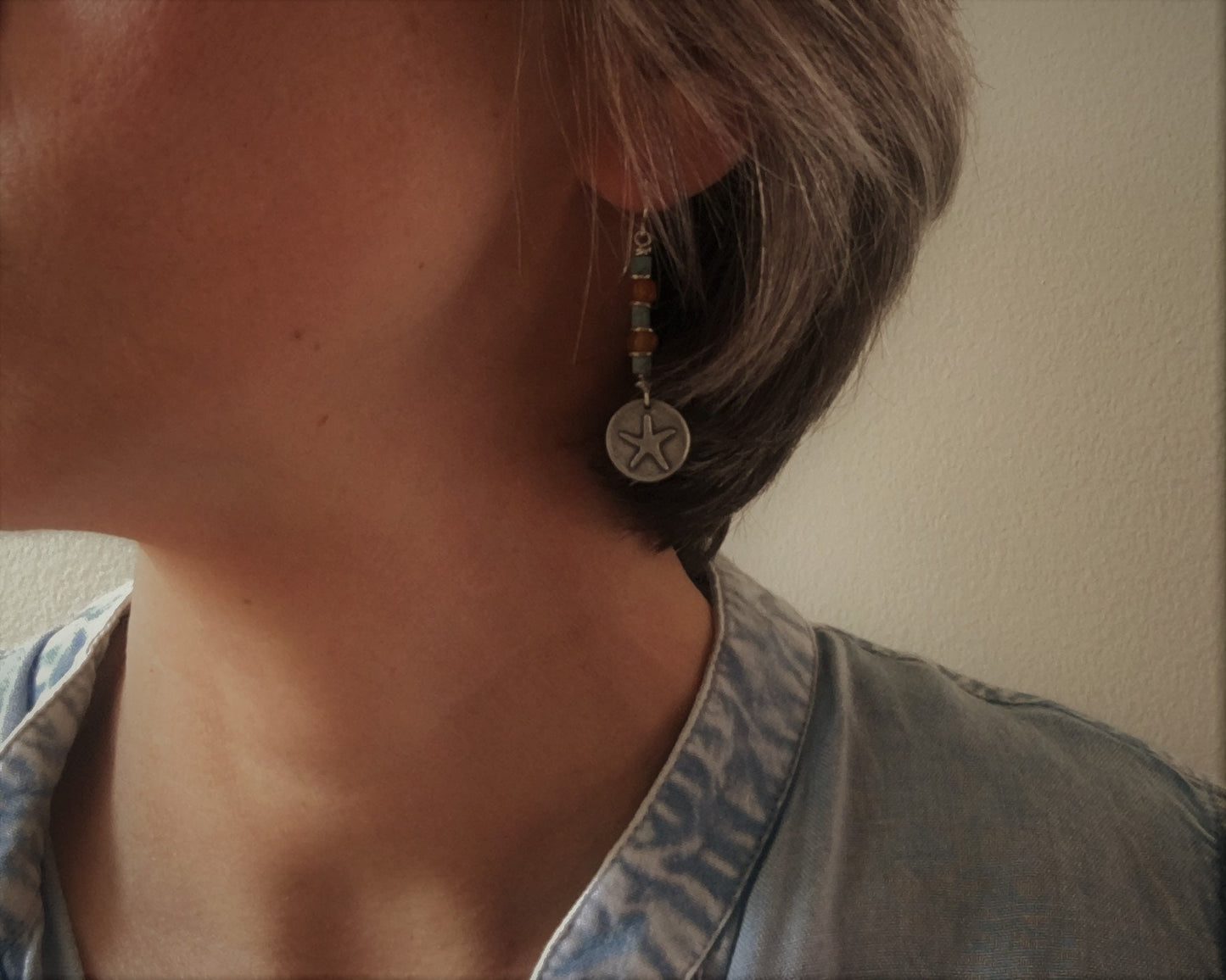 Silver starfish earrings with blue & yellow bead stack