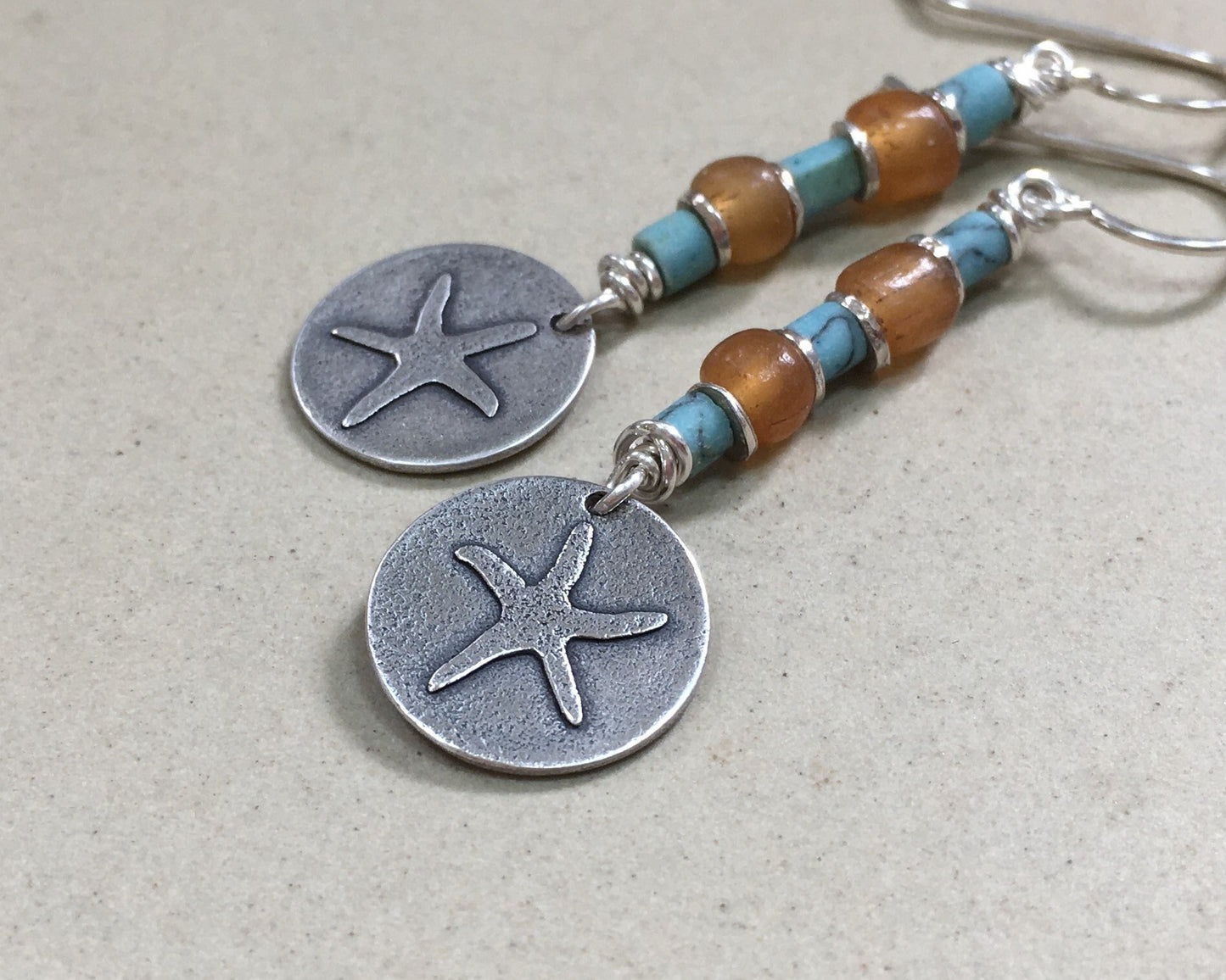 Silver starfish earrings with blue & yellow bead stack