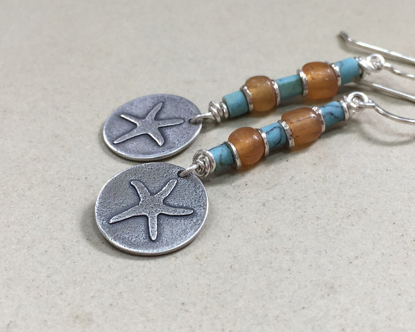 Silver starfish earrings with blue & yellow bead stack