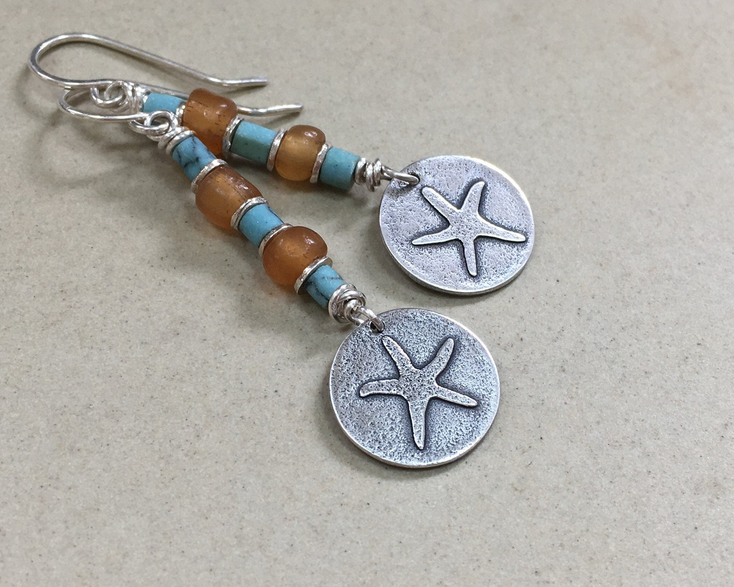 Silver starfish earrings with blue & yellow bead stack