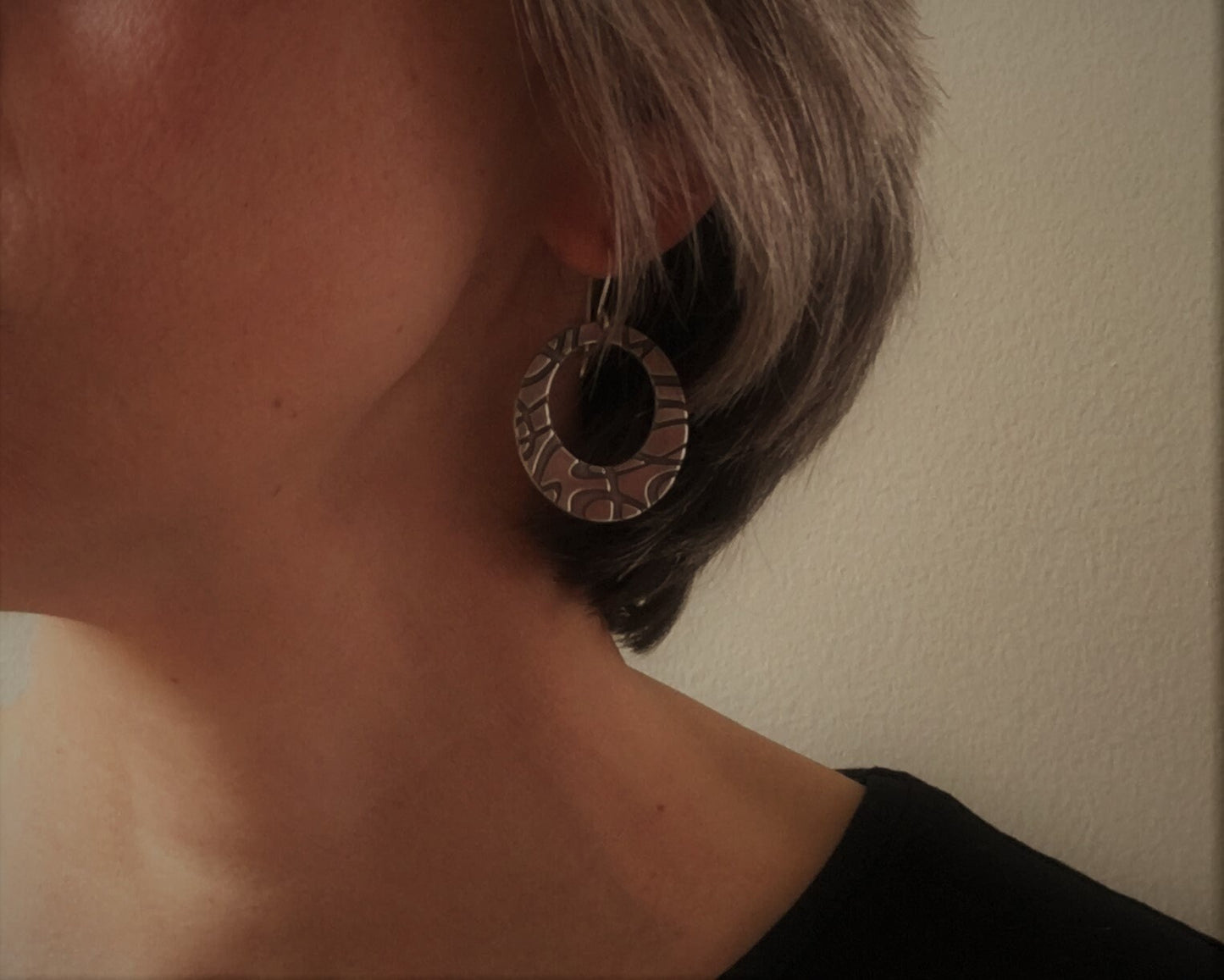 Stylized swirly hoops in oxidized sterling silver