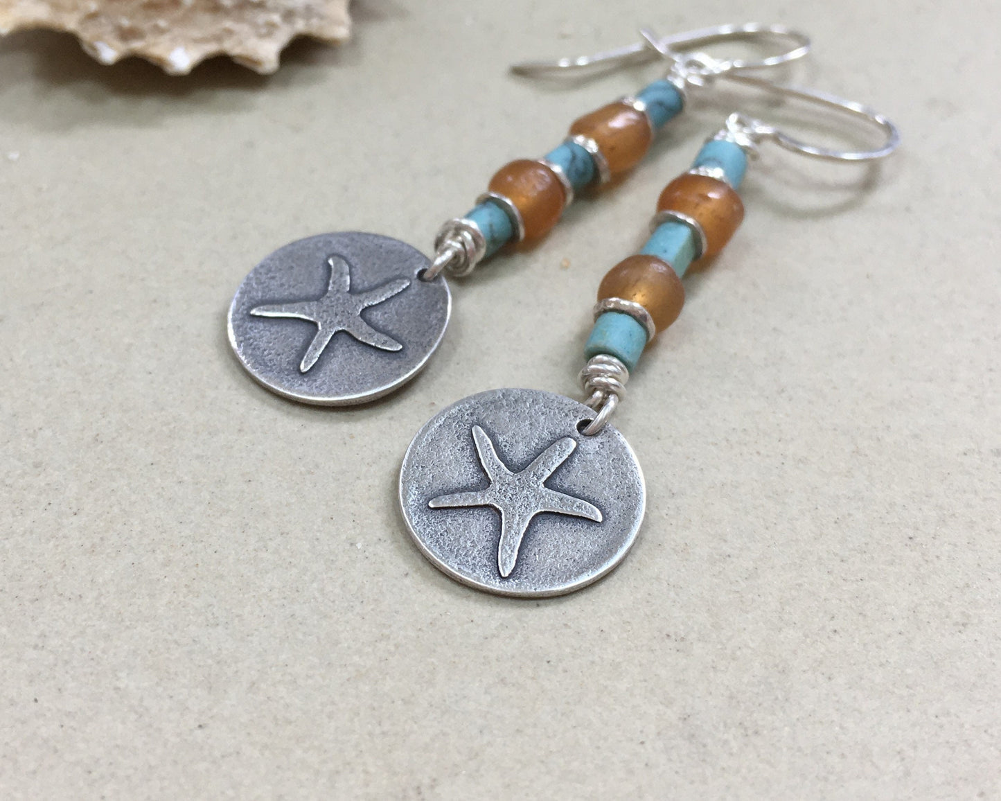 Silver starfish earrings with blue & yellow bead stack