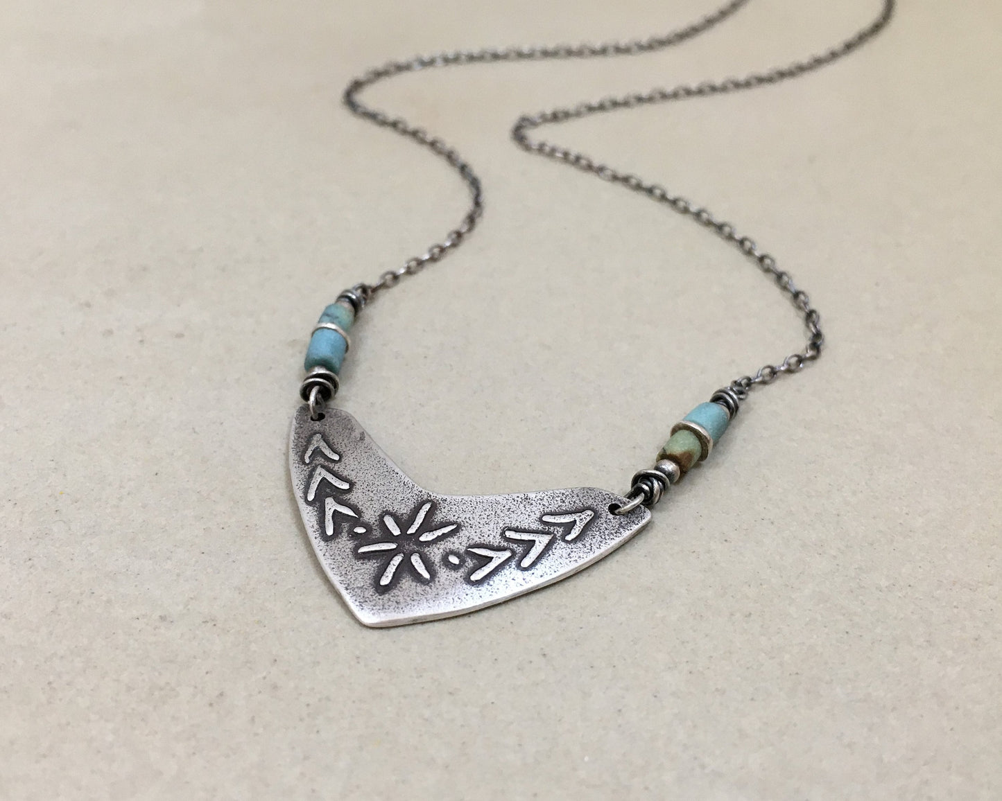 Tribal style beaded boomerang necklace