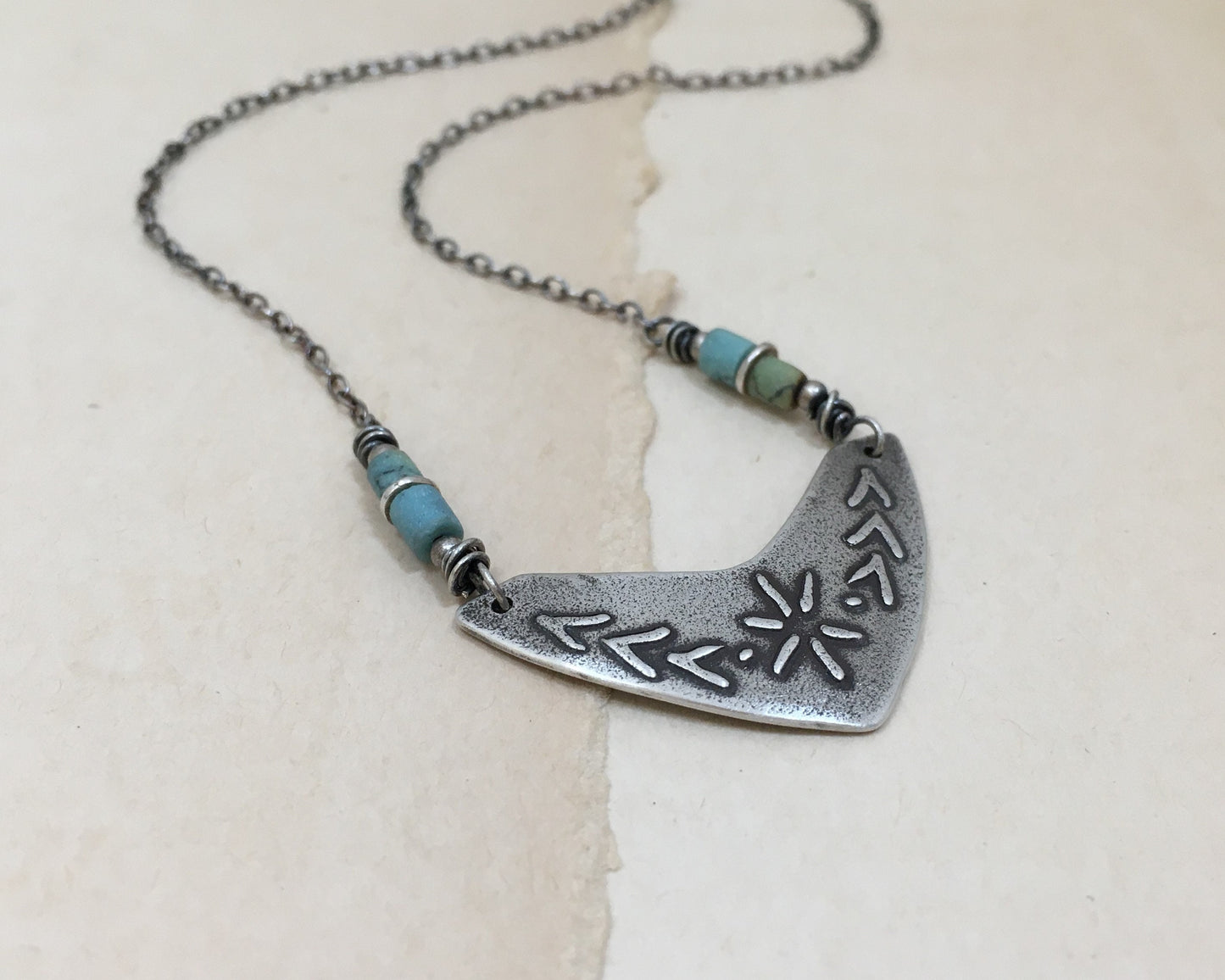 Tribal style beaded boomerang necklace