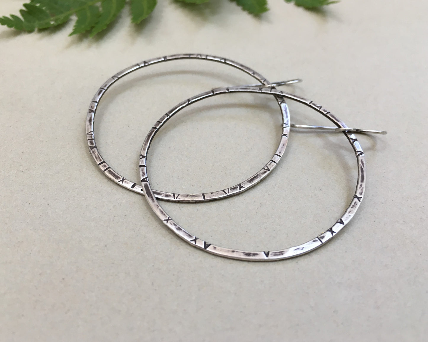Large textured hoops in oxidized sterling silver