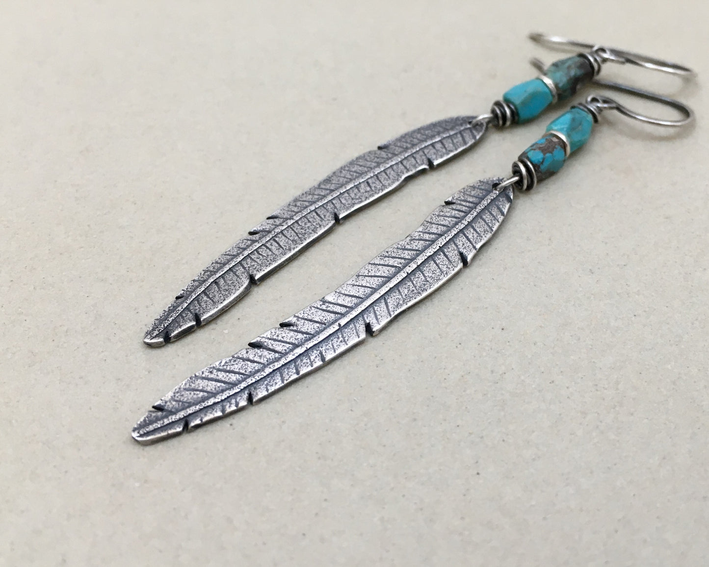 Rustic boho silver feather earrings with turquoise