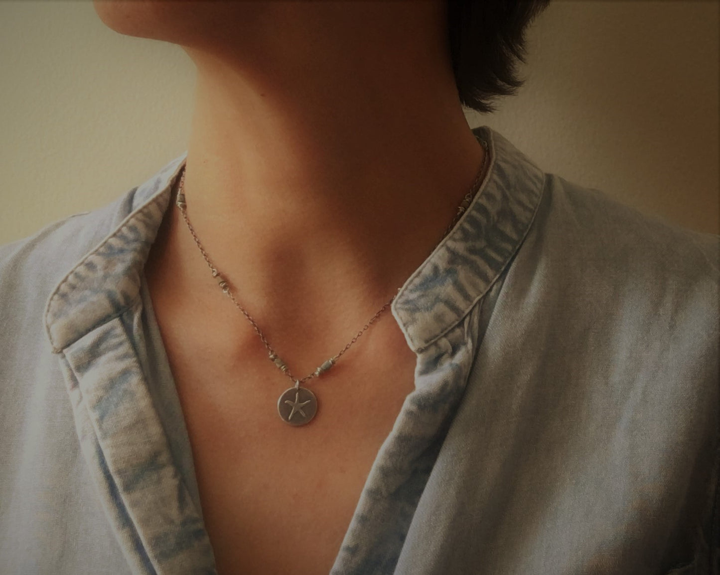 Silver starfish necklace on beaded chain