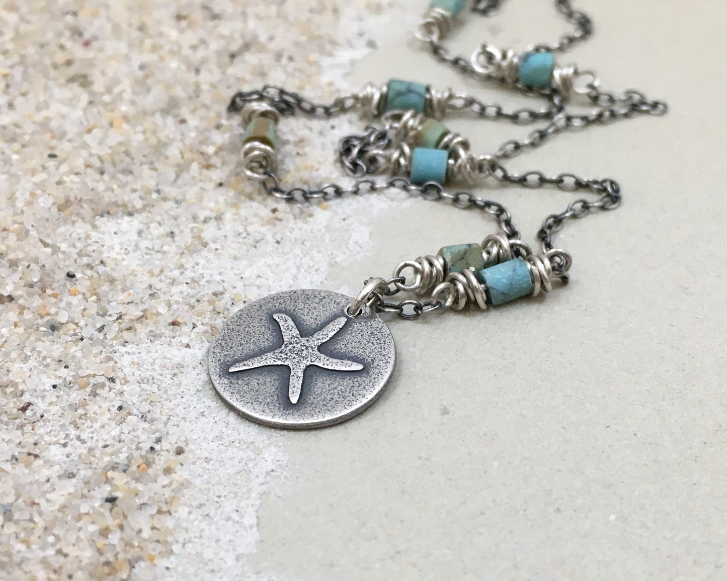 Silver starfish necklace on beaded chain