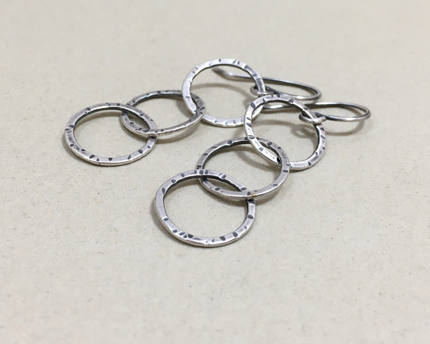 Triple linked textured hoops in oxidized sterling silver