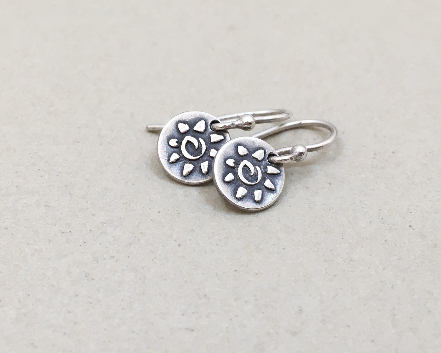 Tiny primitive sun earrings in oxidized sterling silver
