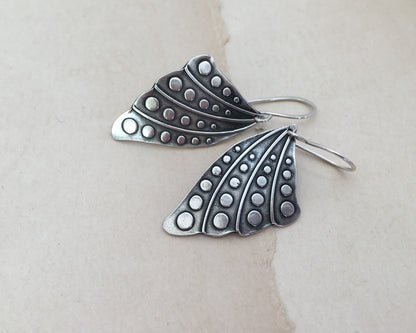 Silver butterfly wing earrings with polka dots