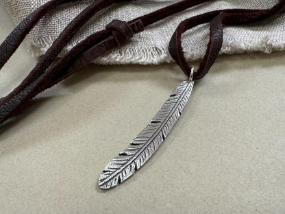 Tribal style silver feather necklace on leather or chain