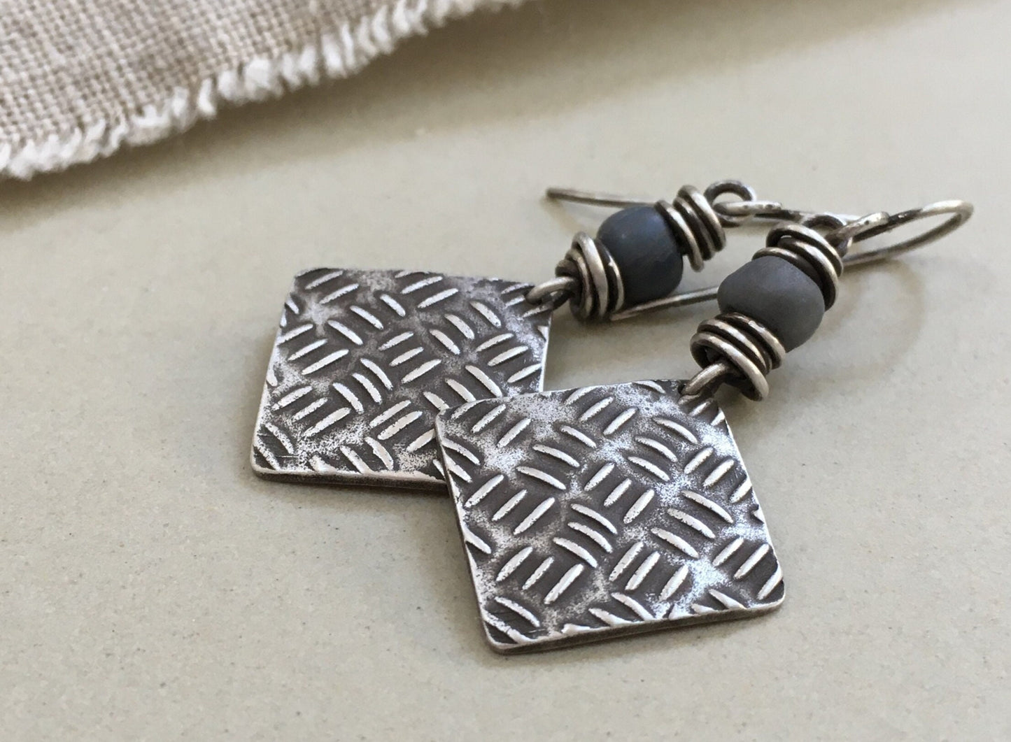 Sashiko cross stitch earrings in oxidized sterling silver with gray Java glass bead