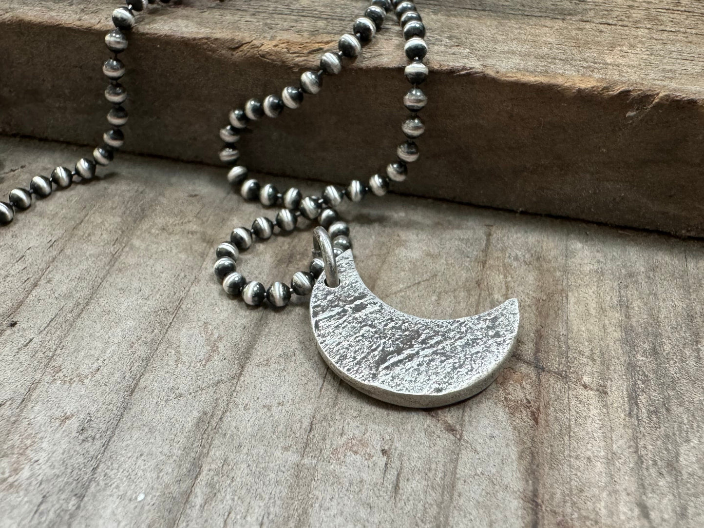 Chunky rock textured silver crescent moon necklace