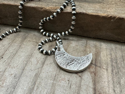 Chunky rock textured silver crescent moon necklace