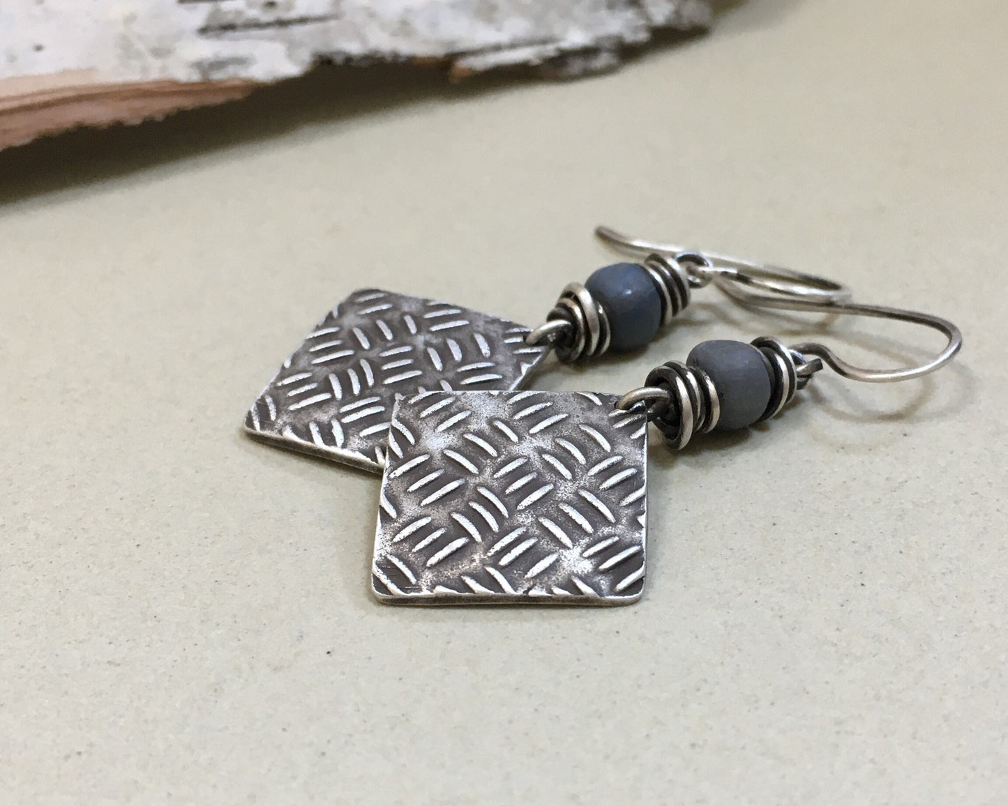 Sashiko cross stitch earrings in oxidized sterling silver with gray Java glass bead