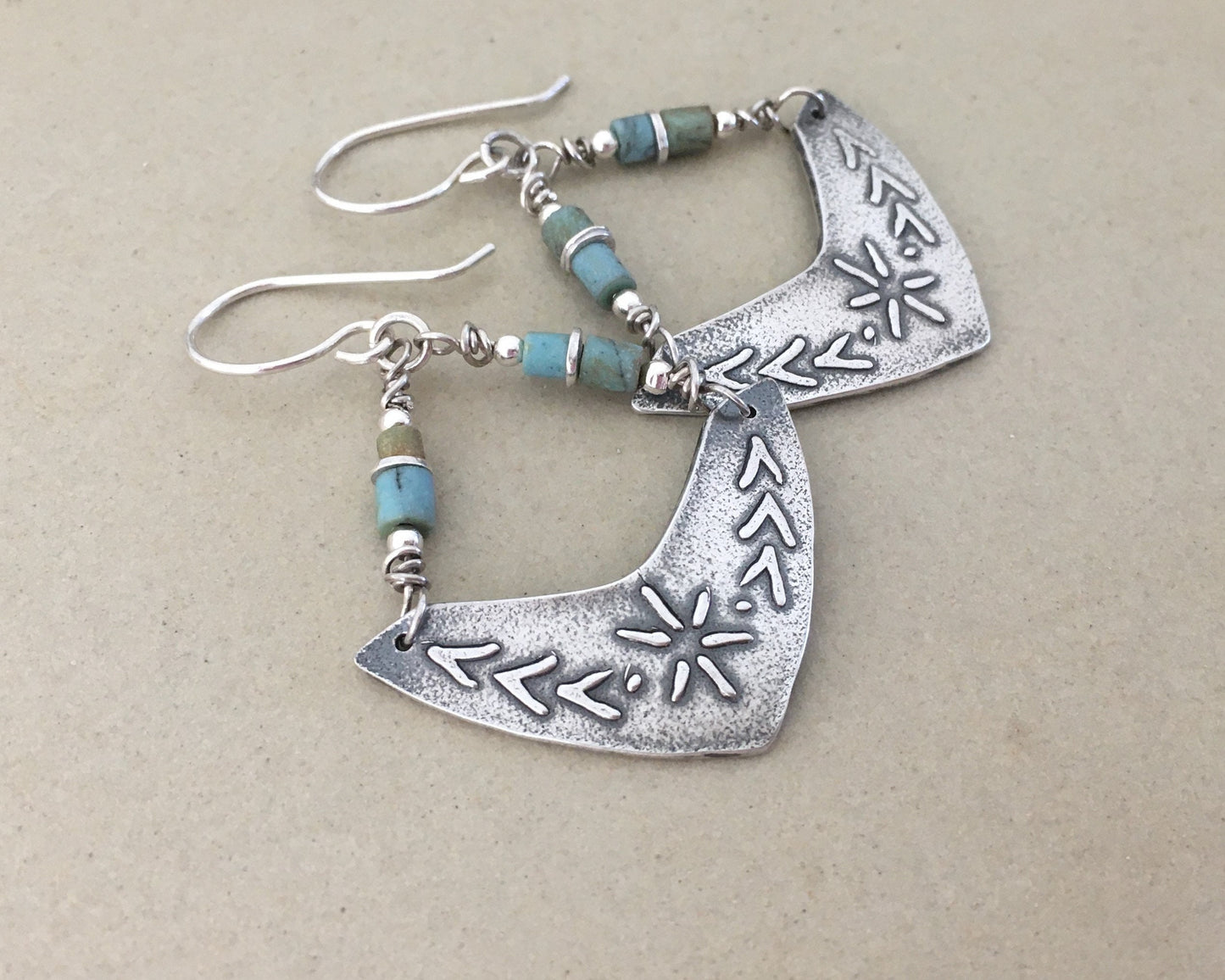 Silver boomerang earrings with blue stone beads