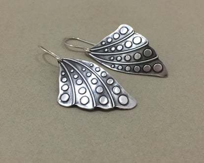 Silver butterfly wing earrings with polka dots