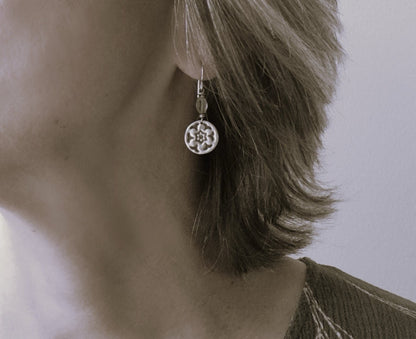 Silver stamped flower earrings with green peridot