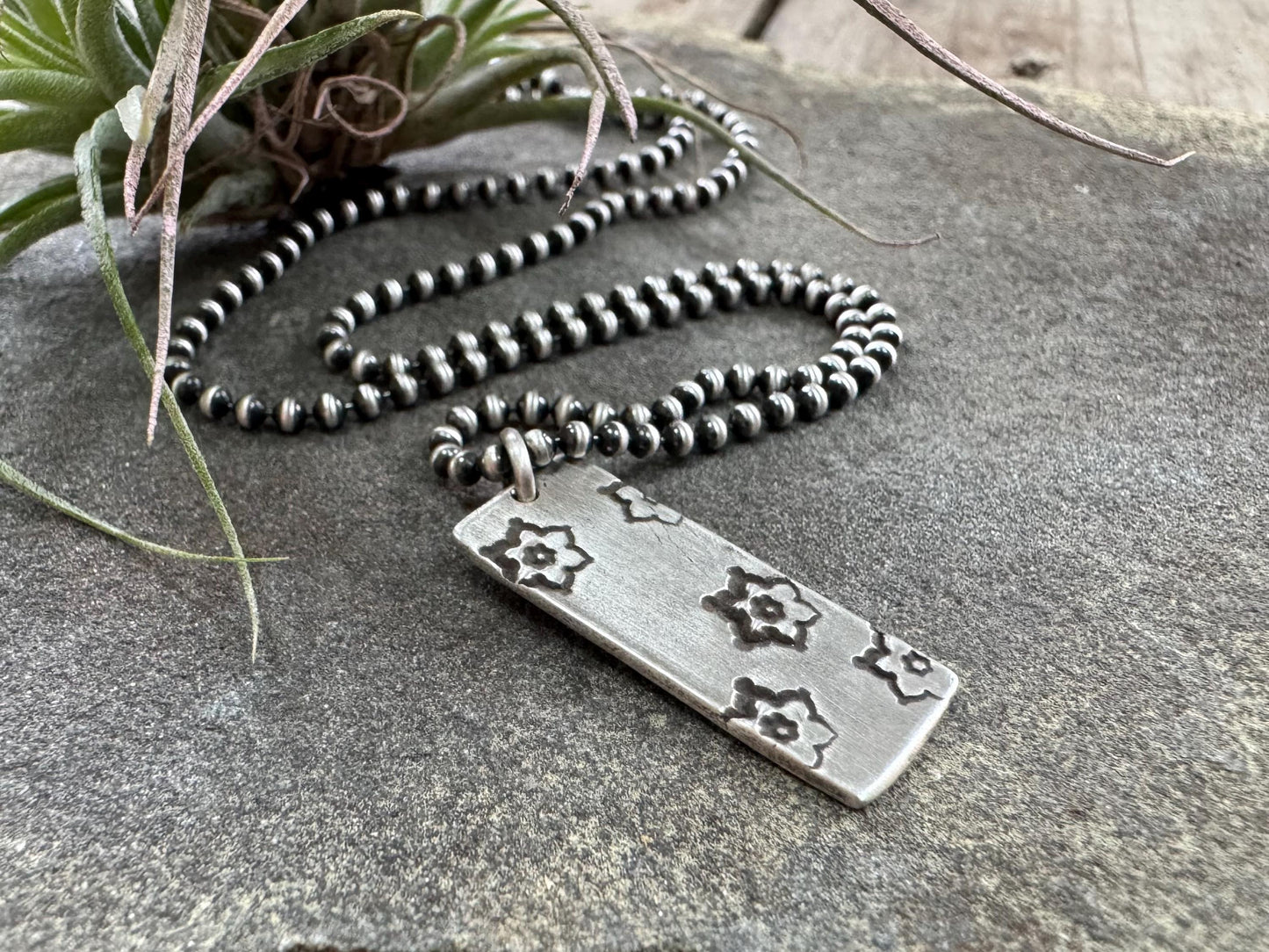 Silver stamped flower dog tag necklace