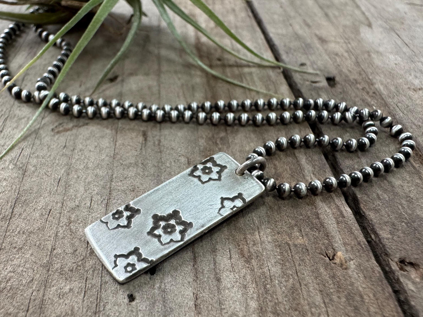 Silver stamped flower dog tag necklace