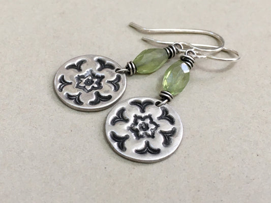 Silver stamped flower earrings with green peridot