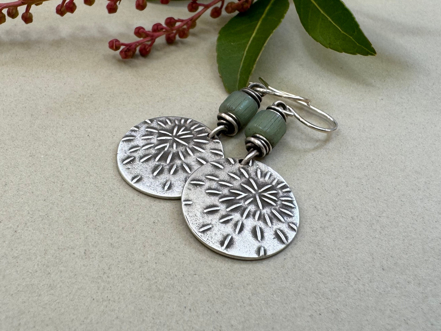 Silver starburst sashiko stitch earrings with seafoam green Java glass